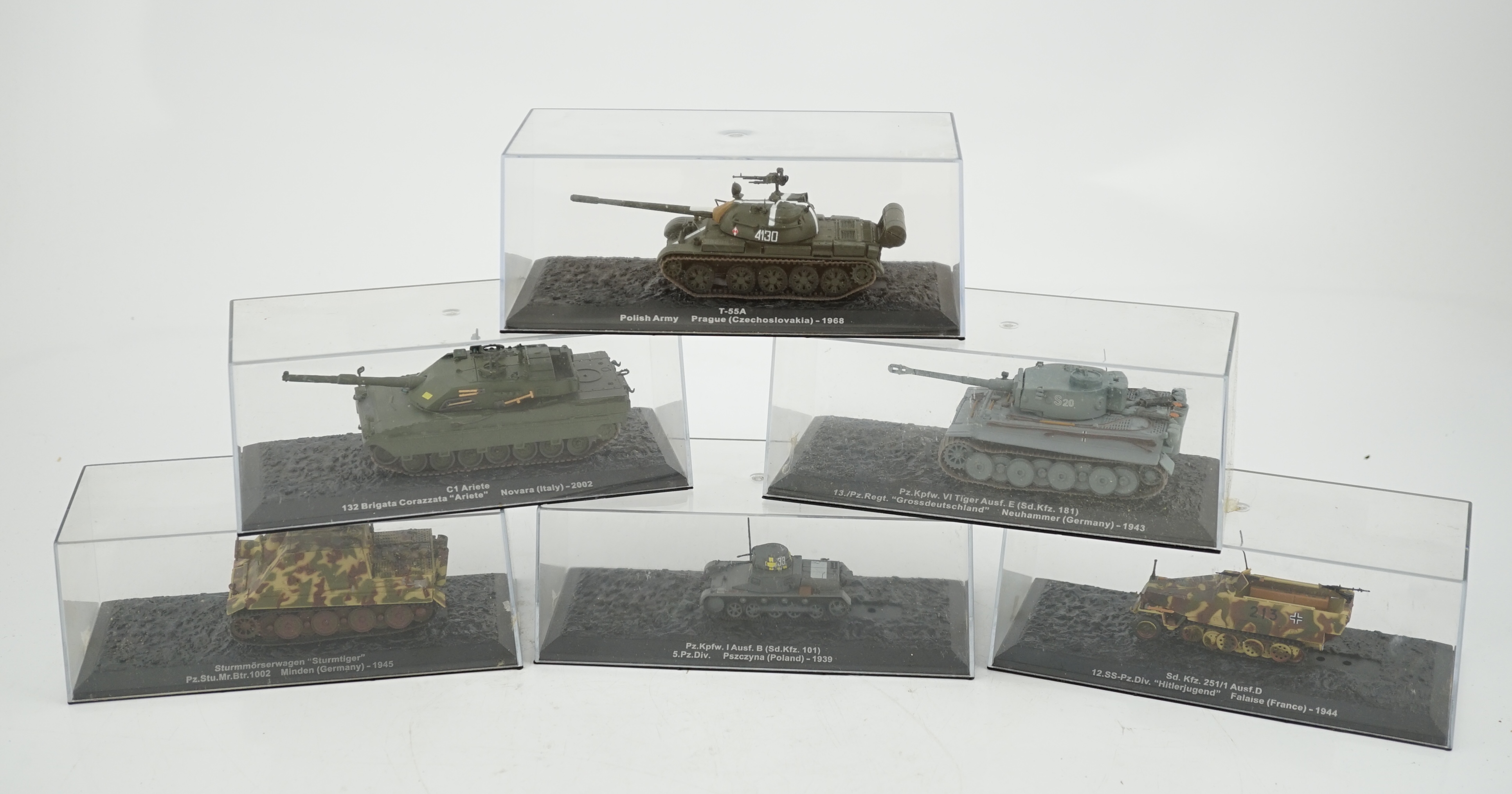 Sixty-eight magazine issue military vehicles in plastic display cases, including; tanks, armoured cars, personnel transporters, etc.